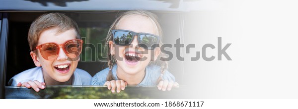 Cute kids with big sunglasses and big smiles blank space\
banner 