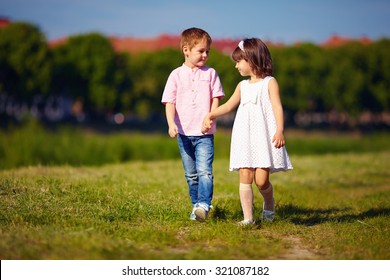 Cute Kids, Couple Walking On Summer Field