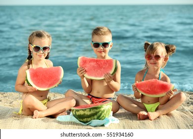 Cute Kids Eating Watermelon On Beach