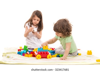 Cute Kids Playing Home With Colorful Cubes Toys Against White Background