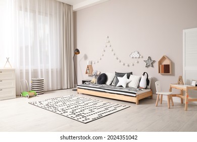 Cute Kids Room With Stylish Comfortable Floor Bed And Toys. Montessori Interior