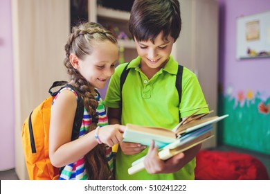 Cute Kids Studying Together In Classroom At School