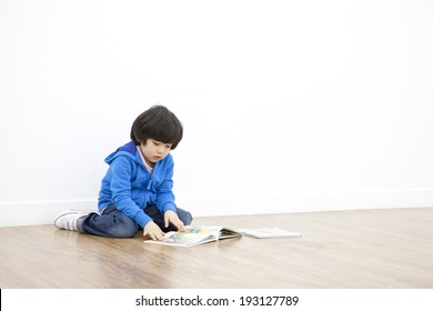 Cute Korean Boy Reading Comic Book