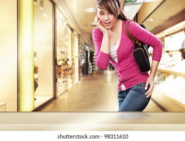 Cute Lady Looking At A Shop Window In Shopping Center