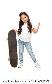 Cute Latin Kid Showing Thumb Up While Holding Penny Board Isolated On White