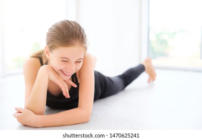Cute laughing lying on a floor in white room - Shutterstock ID 1470625241