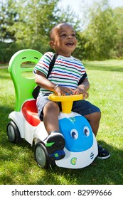 Cute Little African American Baby Boy Playing At Park