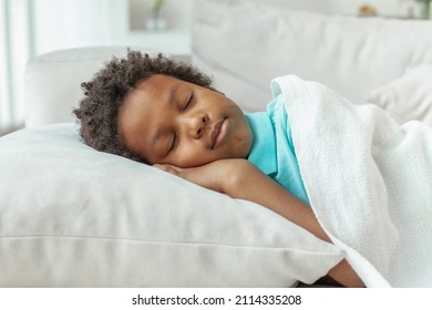 Cute Little African American Boy Child Sleeping In Bed