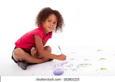 Cute Little African American Girl Painting On The Floor