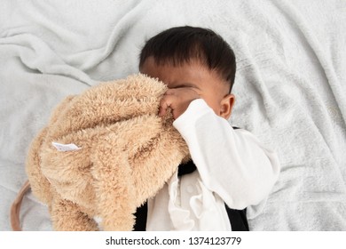 Cute Little Asain Baby Boy Lying On Soft Towel And Play Toy