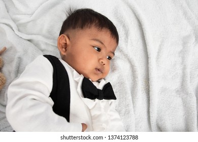 Cute Little Asain Baby Boy Lying On Soft Towel And Play Toy