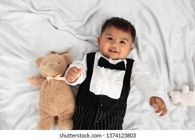 Cute Little Asain Baby Boy Lying On Soft Towel And Play Toy