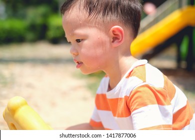 Cute Little Asian 2 - 3 Years Old Toddler Baby Boy Child Sweating During Having Fun Playing, Exercising Outdoor At Playground On Nature At Park, Heat Stroke And Summer Sunstroke Risk Symptom Concept