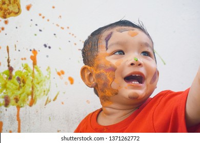 Cute Little Asian Baby 1 Years Old Toddler Boy Child Painting Wall Full Color, Kid Coloring At Home, Play For Toddlers Concept.