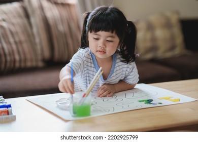 Cute little asian baby smiling painting with colorful paints using watercolor. Asian girl using paintbrush drawing color. Baby activity lifestyle concept. - Powered by Shutterstock