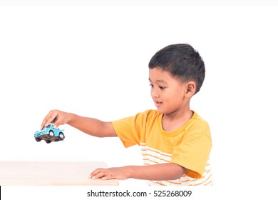 Cute Little Asian Boy Child Kid Preschooler Playing With Blue Car Toy