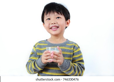 Cute Little Asian Boy Drinking Milk With Glass