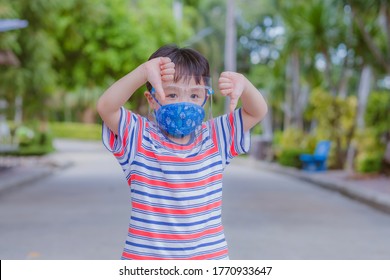 Cute Little Asian Boy Wear Face Mask And Sheild As Protection During The Covid 19 Virus Outbreak. Copy Space.