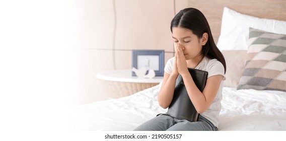 Cute Little Asian Girl Praying At Home. Banner For Design