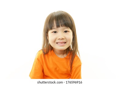 Cute little Asian girl smiling