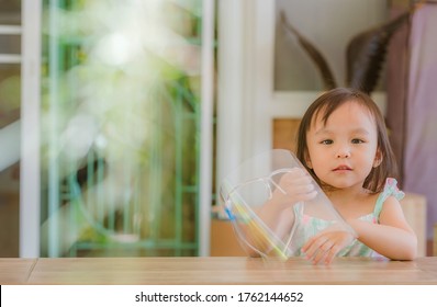 Cute Little Asian Girl Wear Face Mask And Sheild As Protection During The Covid 19 Virus Outbreak. Copy Space.