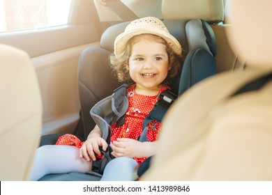 Cute Little Baby Child Sitting In Car Seat. Portrait Of Cute Little Baby Child Sitting In Car Seat.Safety Concept.