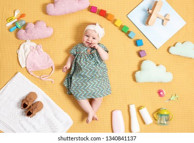 Cute Little Baby With Clothing And Accessories On Color Blanket, Top View