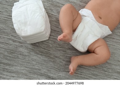 Cute Little Baby In Diaper On Grey Blanket, Top View