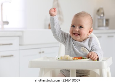 Cute little baby eating healthy food at home. Space for text - Powered by Shutterstock