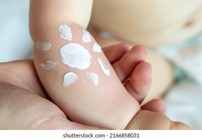 Cute Little Baby Hand And Sun Shape Drawn With Protective Cream.toddler With Red Burned Skin,sun Damage.sunblock Protective Cream Long Lasting.daddy Hand Holding Childs Hand.vacation,sea