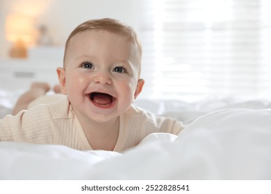 Cute little baby on bed at home