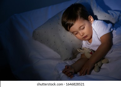 Cute Little Baby Sleeping With Toy At Home. Bedtime