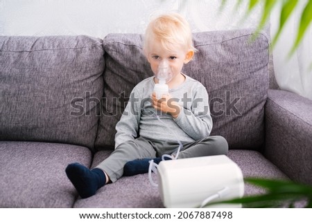 Similar – Image, Stock Photo Blonde boy does a roll under blue water in swimming pool