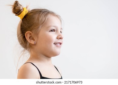 Cute, Little, Blonde Girl With Pigtails Looking At Someone, Smiling