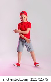 Cute Little Boy Dancing On Grey Background