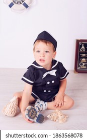 Cute little boy in deckhand sailor costume