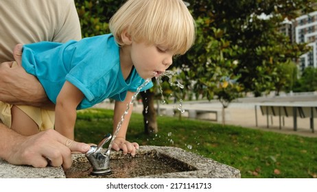 Cute Little Boy Face Portrait Drink Water In A Park From Drinking Fountain Slow Motion