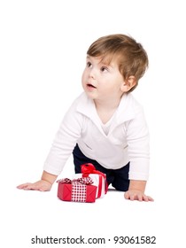 Cute little boy with gift boxes. Isolated on white.