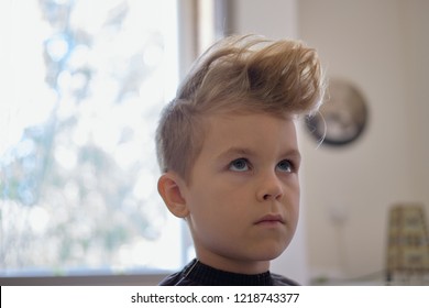 Cute Little Boy With Hairstyle, Sitting At Home. Weird Haircut Made By Mom