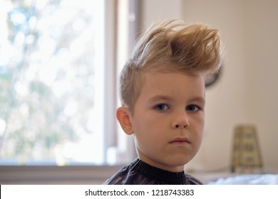 Cute Little Boy With Hairstyle, Sitting At Home. Weird Haircut Made By Mom