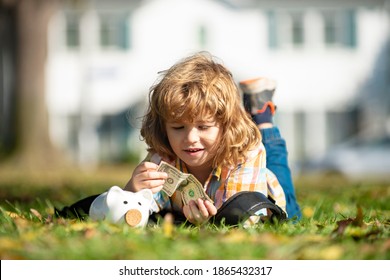 Cute Little Boy Holding Money. Child Saving With One Coin. Money Building Strategy. Portrait Kid With Piggy Bank And Coin. Getting Started Saving Money