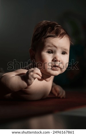 Similar – Nude baby posing in her mother’s arms