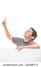 Cute little boy looking up towards blank/empty space (room for your graphics)