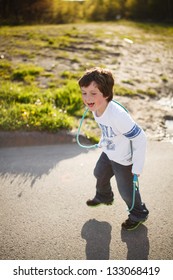 Cute Little Boy Playing Jump Rope