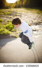 Cute Little Boy Playing Jump Rope