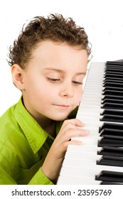 Cute Little Boy Playing Synthesizer Or Piano, Isolated On White Background