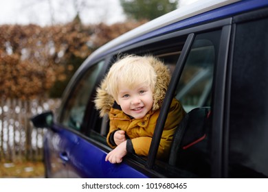 Cute Little Boy Ready For A Roadtrip Or Travel. Family Car Travel With Kids. Child Transportation Safety