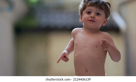 Cute Little Boy Running Outside Towards Camera