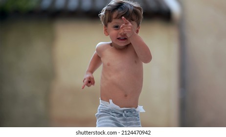 Cute Little Boy Running Outside Towards Camera