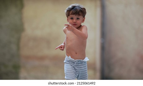 Cute Little Boy Running Outside Towards Camera